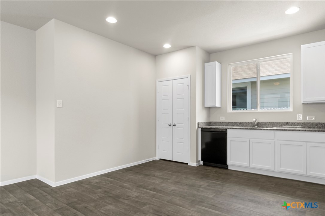 3035 Winding Creek Road Kyle, TX 78640 - Photo 5 of 38 a view of a kitchen with stainless steel appliances granite countertop a stove and a sink