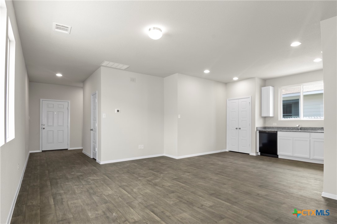 3035 Winding Creek Road Kyle, TX 78640 - Photo 7 of 38 a view of an empty room with a window