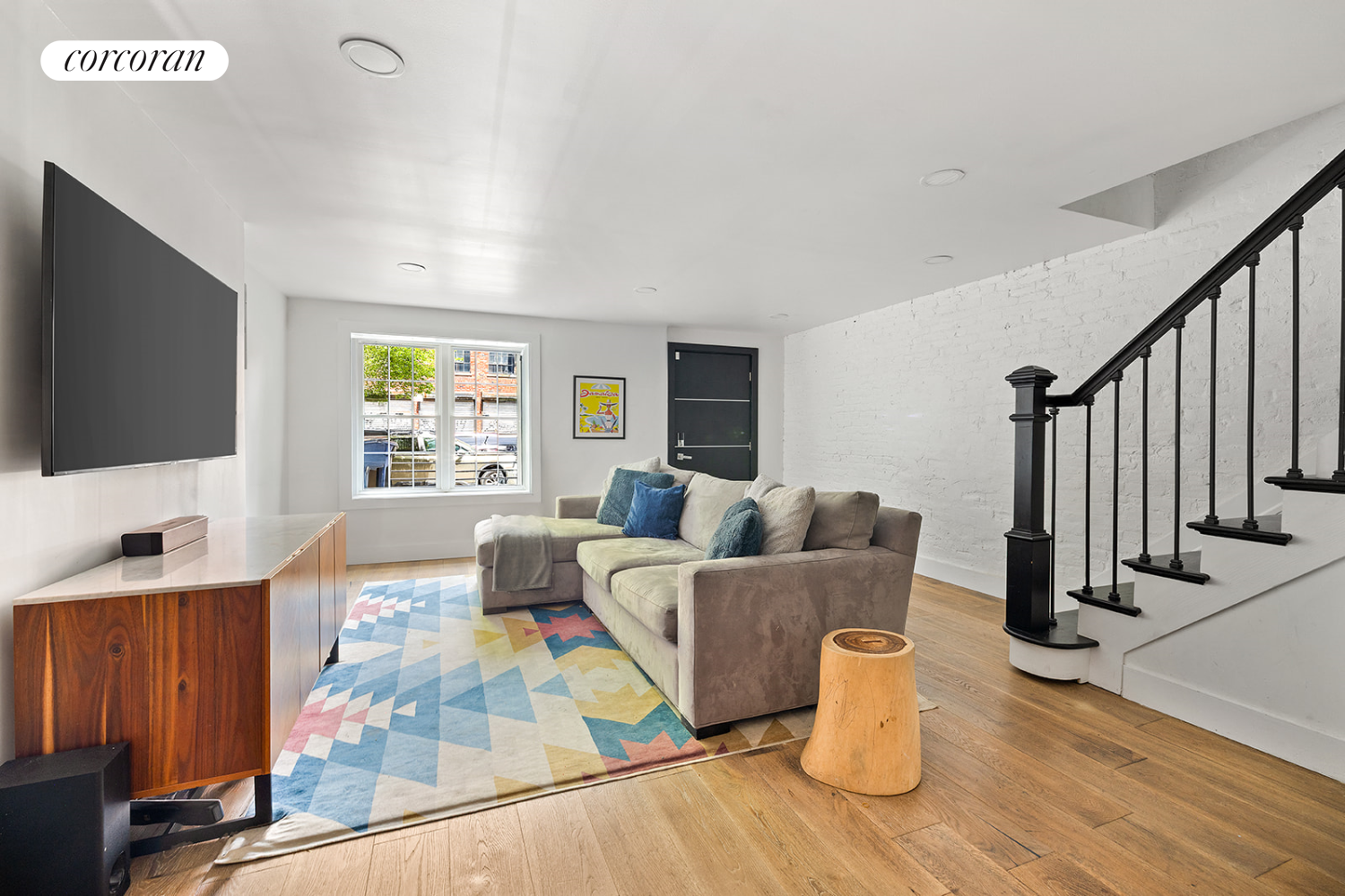 416 Halsey Street Brooklyn, NY 11233 - Photo 13 of 17 a living room with furniture and a flat screen tv