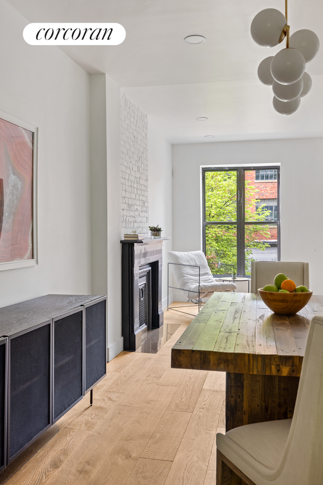 416 Halsey Street Brooklyn, NY 11233 - Photo 4 of 17 a bedroom with a bed and window