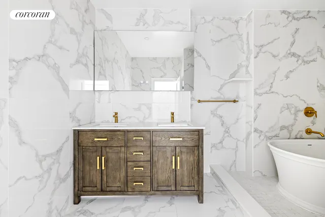 a bedroom with a large bed and a large window