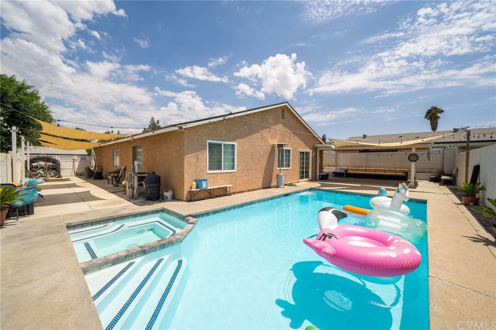 3042 Copenhagen Road Riverside, CA 92504 - Photo 1 of 1 a front view of a house with swimming pool