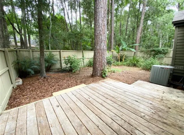 a view of a backyard with a deck
