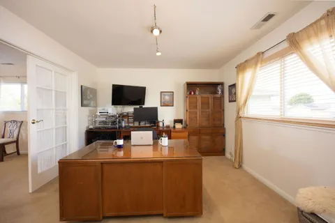 a living room with fireplace furniture and a flat screen tv