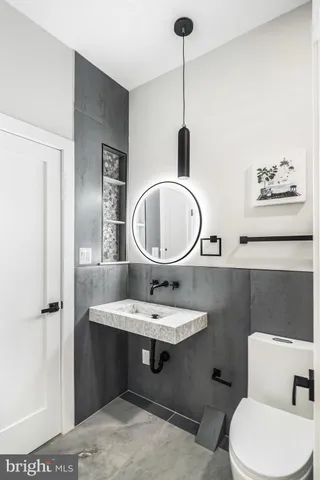 a bathroom with a shower and a mirror
