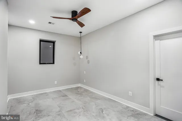 a white bath tub sitting next to a shower