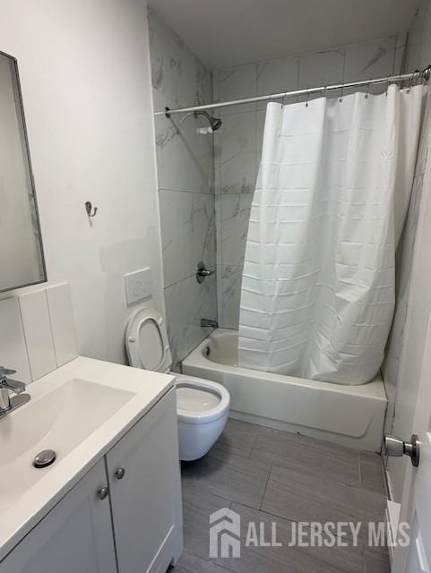 439 Barclay Street Perth Amboy, NJ 08861 - Photo 2 of 7 a bathroom with a granite countertop sink toilet and shower