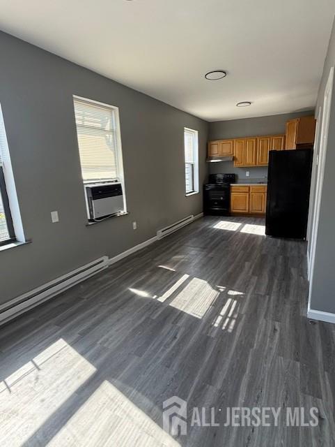 439 Barclay Street Perth Amboy, NJ 08861 - Photo 5 of 7 a view of empty room with wooden floor and window