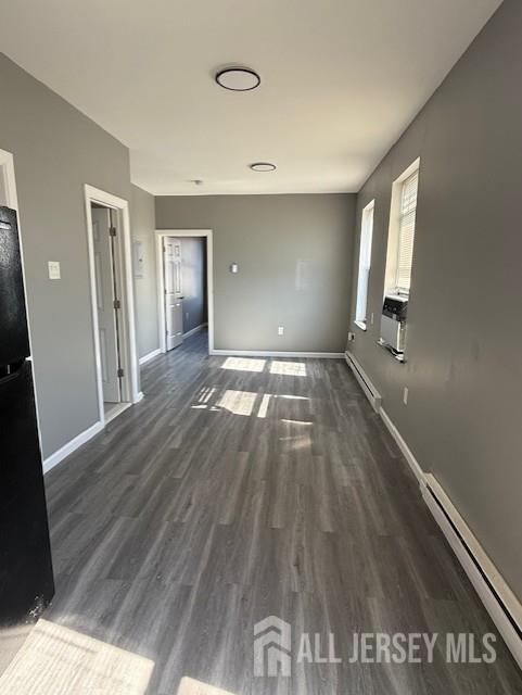 439 Barclay Street Perth Amboy, NJ 08861 - Photo 6 of 7 a view of an empty room with wooden floor and a window
