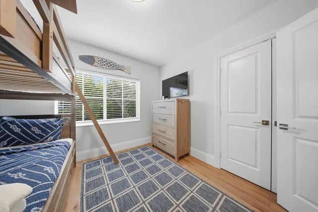 an aerial view of ocean and houses with outdoor space