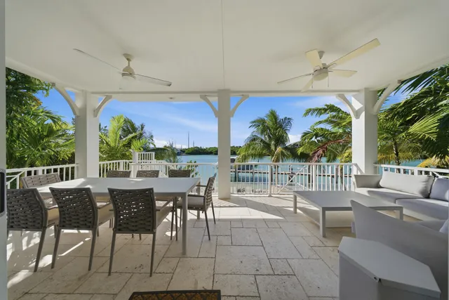 a living room with a couch and a dining table