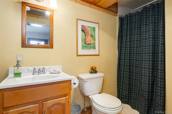 a bedroom with a bed and a rug