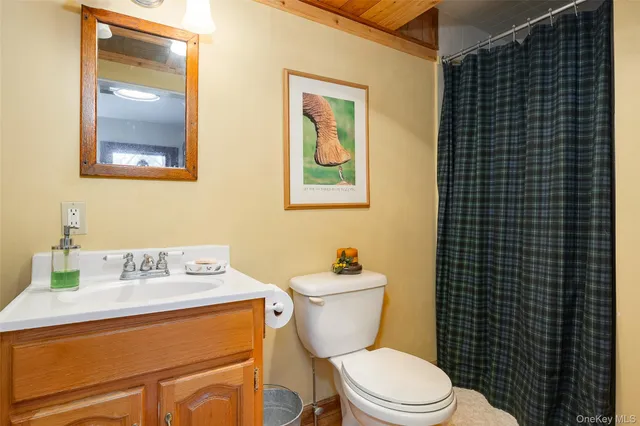 a bedroom with a bed and a rug