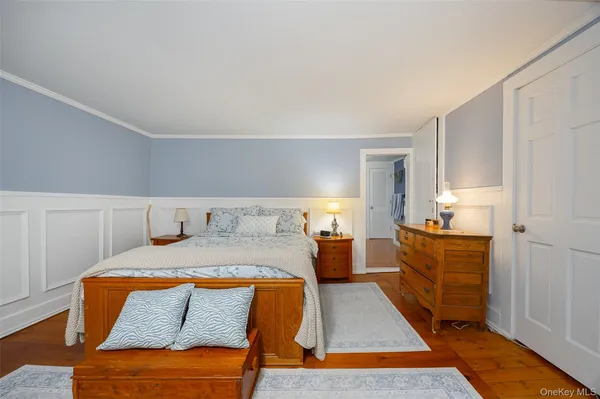 a spacious bedroom with a bed and furniture