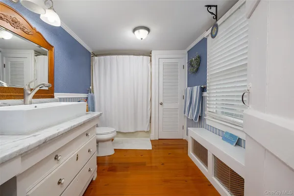 a bedroom with a bed and lamp