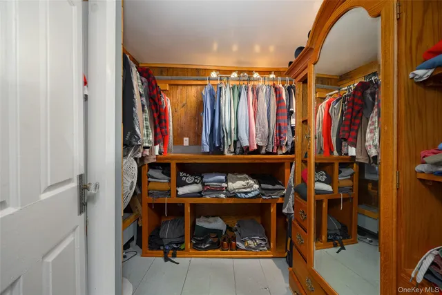 a room that has a bed and a table in it