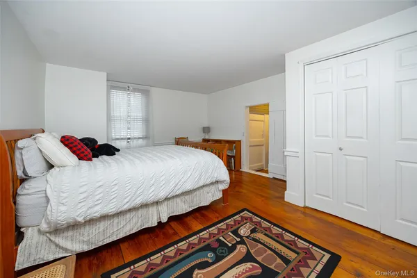 a kitchen with stainless steel appliances a stove a microwave and white cabinets