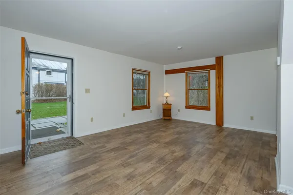 a kitchen with granite countertop a refrigerator stove top oven and sink
