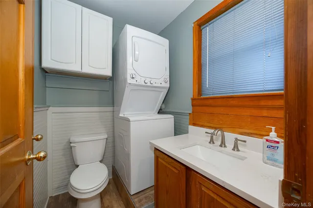 a view of an entryway with wooden floor