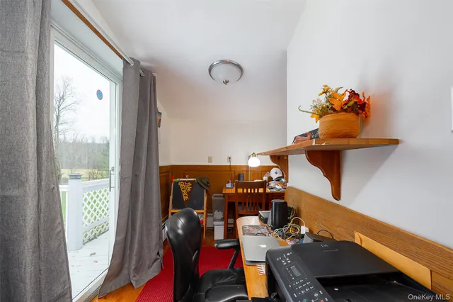 a view of entryway with wooden floor