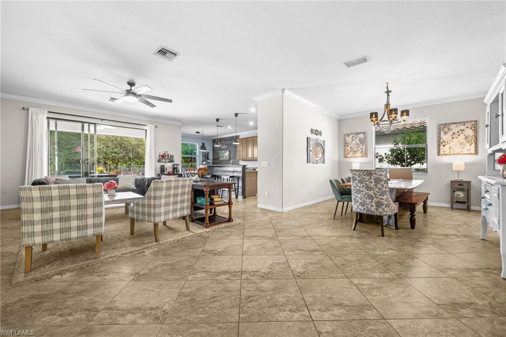 4754 Abaca Circle Naples, FL 34119 - Photo 14 of 46 a living room with furniture and a large window