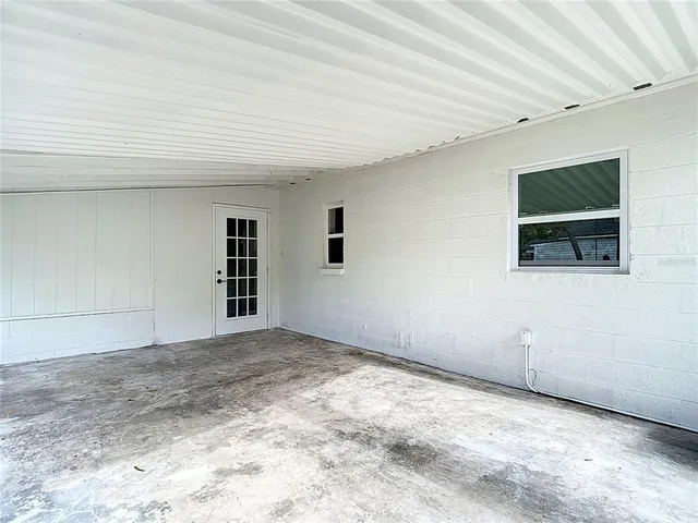 an aerial view of residential houses with outdoor space and street view