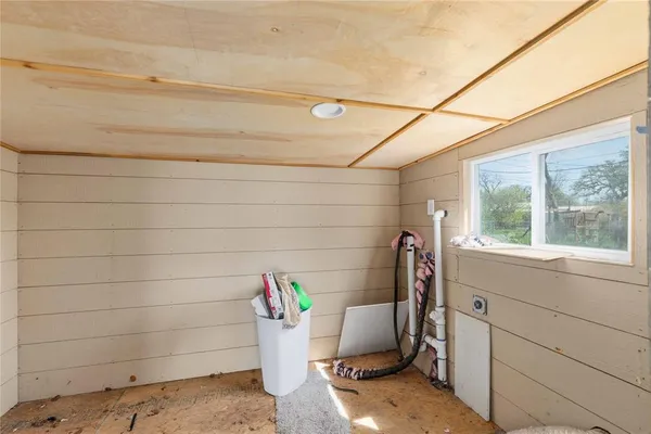 a view of a door and window in the room