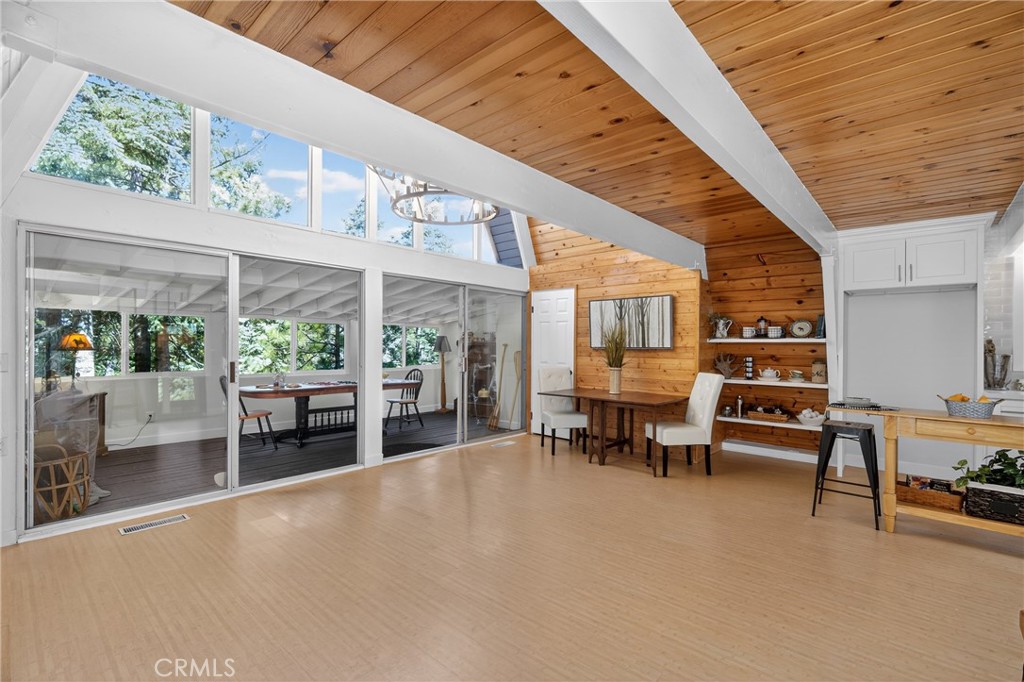 26980 Everest Road Lake Arrowhead, CA 92391 - Photo 14 of 49 a view of a patio with table and chairs and potted plants