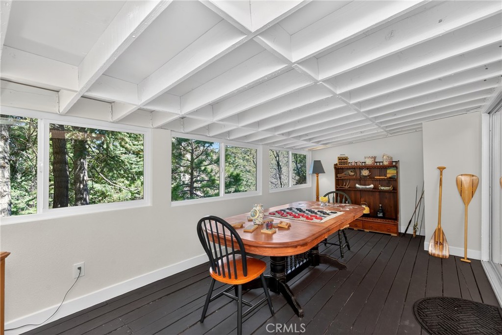 26980 Everest Road Lake Arrowhead, CA 92391 - Photo 18 of 49 a view of a dining room with furniture window and wooden floor