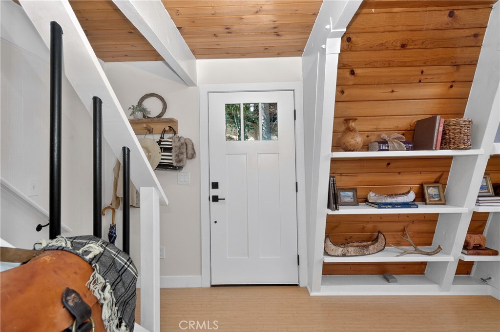26980 Everest Road Lake Arrowhead, CA 92391 - Photo 34 of 49 a view of walk in closet with clothes and shoes