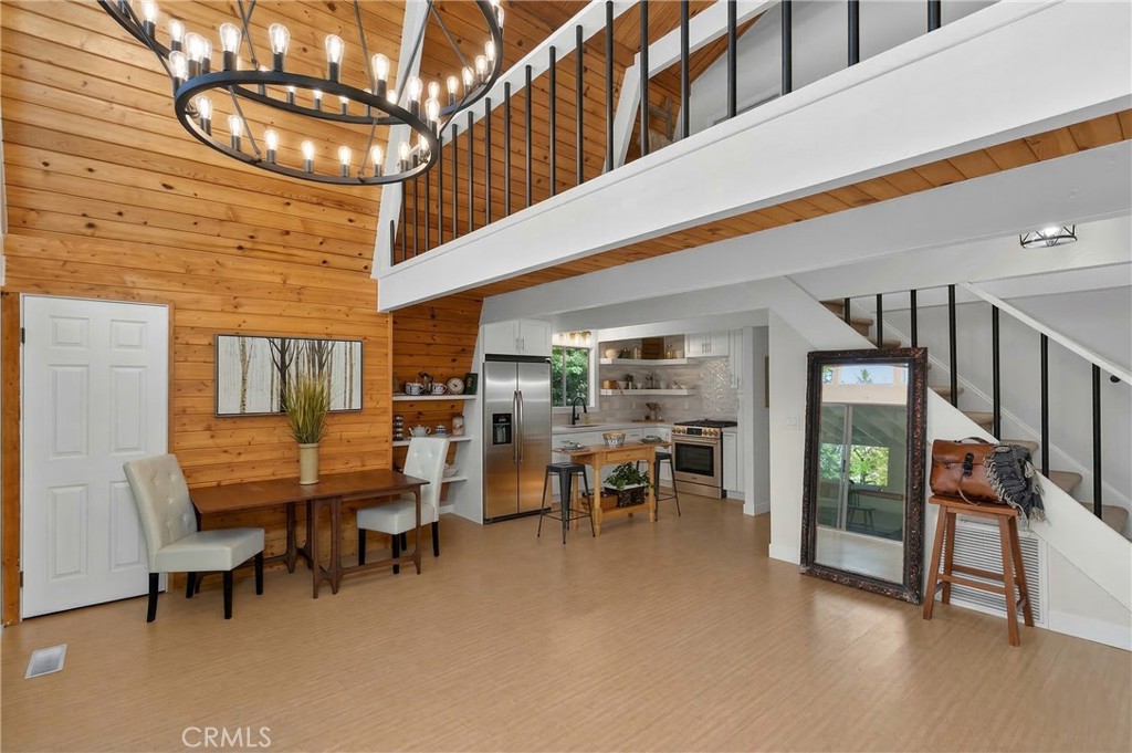 26980 Everest Road Lake Arrowhead, CA 92391 - Photo 37 of 49 a dining room with furniture and a chandelier