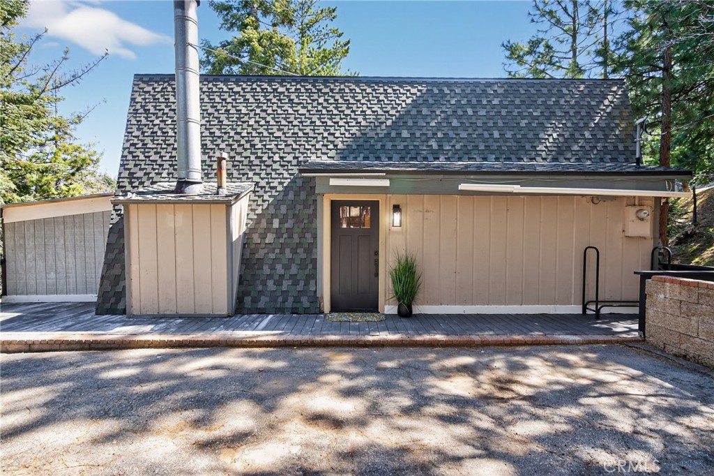 26980 Everest Road Lake Arrowhead, CA 92391 - Photo 44 of 49 a front view of a house with a garage