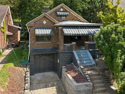 a front view of a house with parking