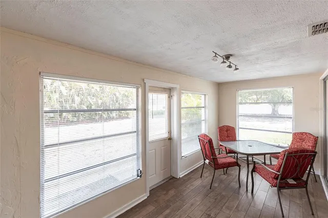 a view of a dining room with furniture window and outside view
