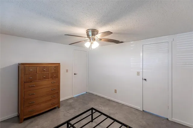 a bathroom with a sink a mirror a toilet and shower