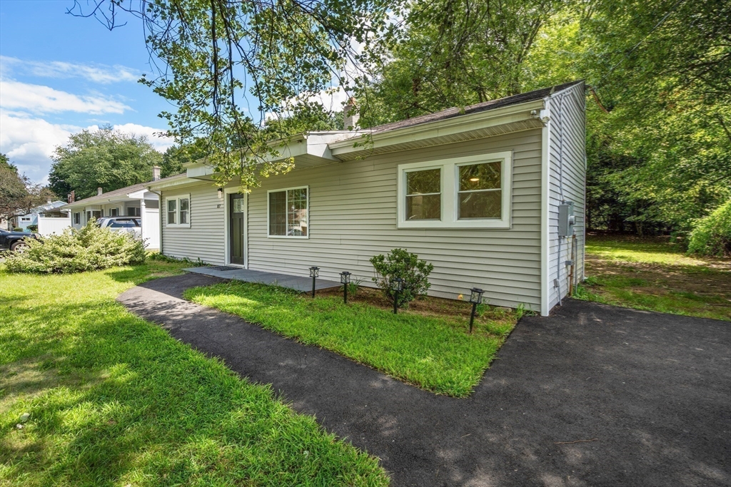 87 Vincent Street Springfield, MA 01129 - Photo 27 of 32 a front view of house with yard and green space