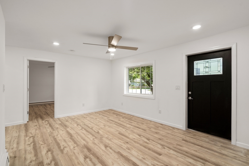 87 Vincent Street Springfield, MA 01129 - Photo 3 of 32 wooden floor in an empty room with a window