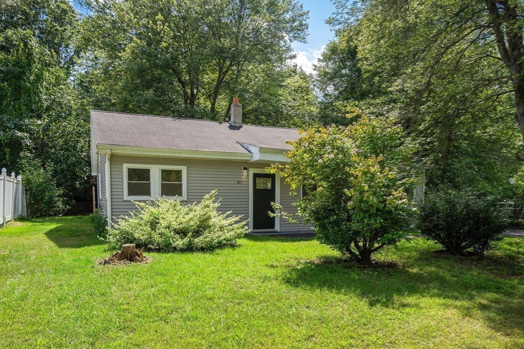 87 Vincent Street Springfield, MA 01129 - Photo 31 of 32 a view of a house with a yard and a garden