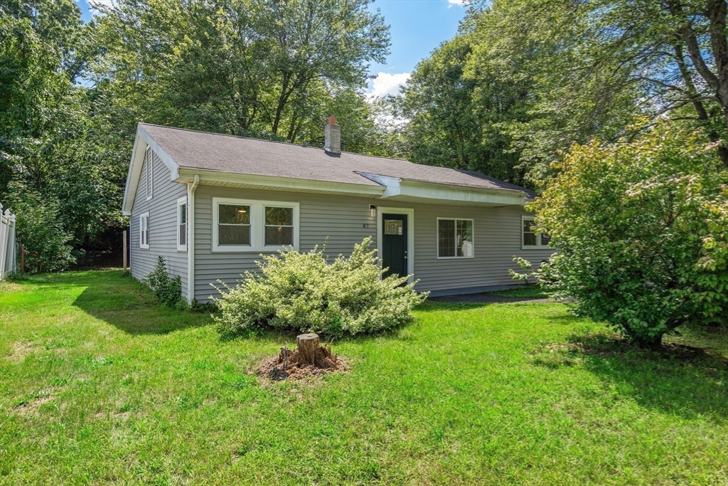 87 Vincent Street Springfield, MA 01129 - Photo 32 of 32 a front view of house with yard and green space