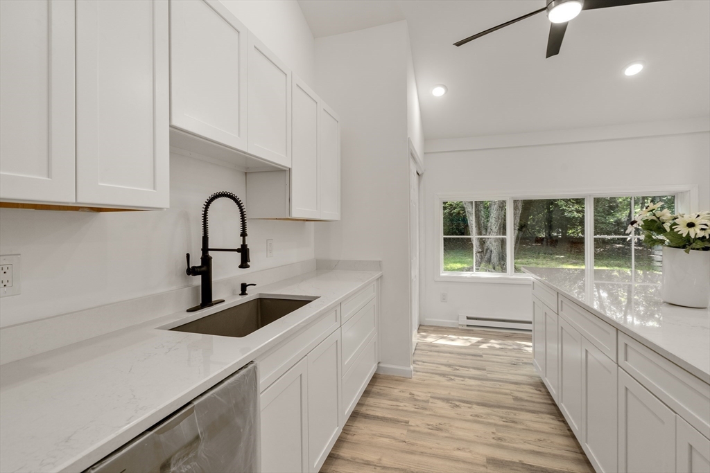 87 Vincent Street Springfield, MA 01129 - Photo 6 of 32 a kitchen with a sink and large window