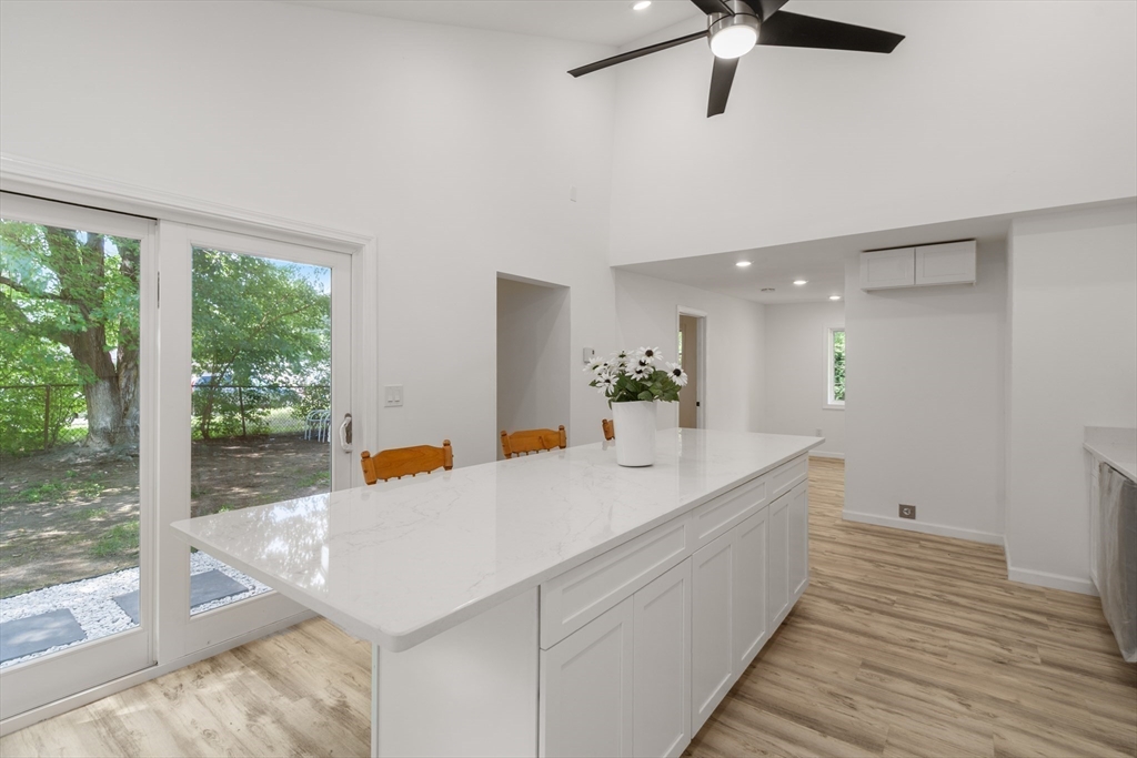 87 Vincent Street Springfield, MA 01129 - Photo 9 of 32 a view of a kitchen with a sink and wooden floor