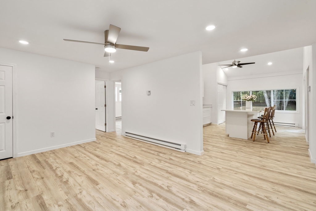 87 Vincent Street Springfield, MA 01129 - Photo 10 of 32 an empty room with wooden floor and outdoor view
