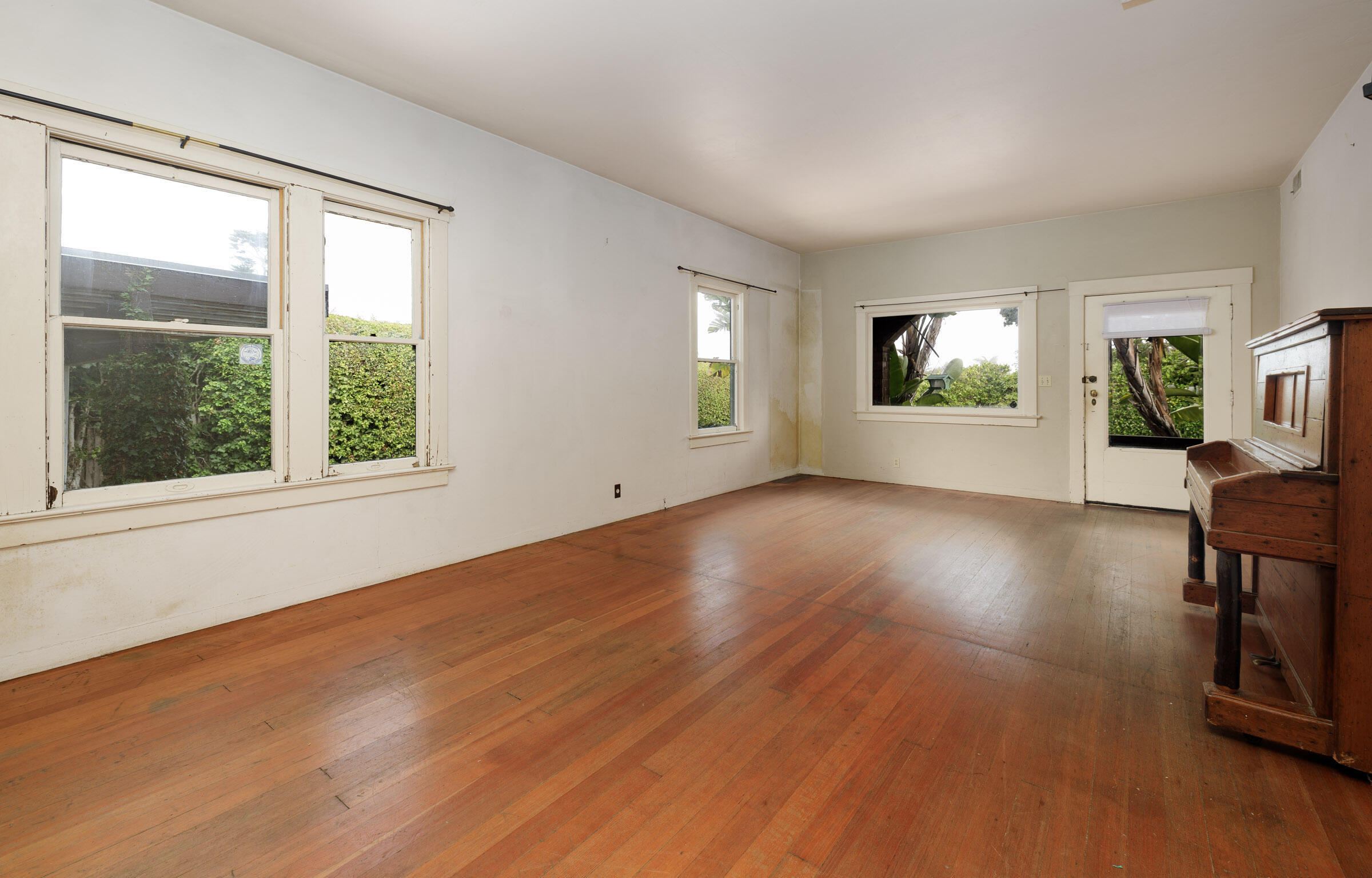 1126 Las Olas Avenue Santa Barbara, CA 93109 - Photo 12 of 24 a view of an empty room with wooden floor and a window