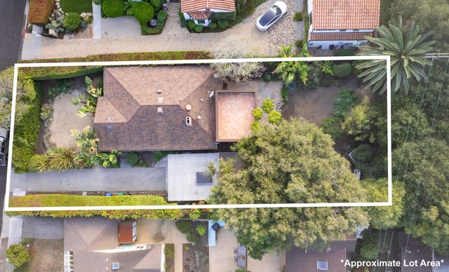 an aerial view of residential house with outdoor space
