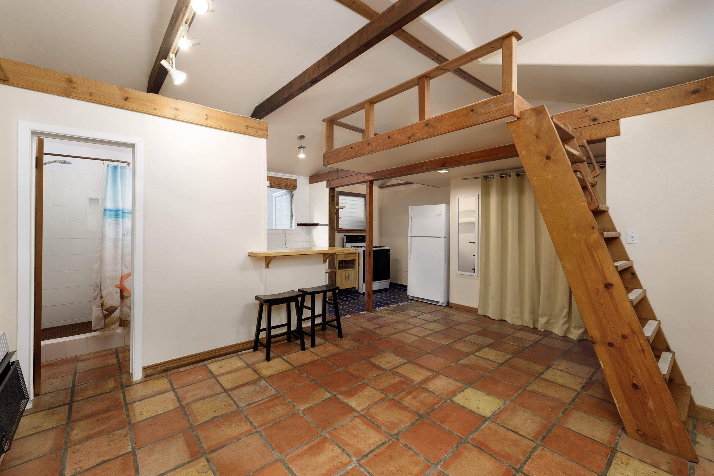 1126 Las Olas Avenue Santa Barbara, CA 93109 - Photo 21 of 24 a view of a hallway with dining area and chandelier