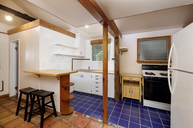 a view of a room with a large window