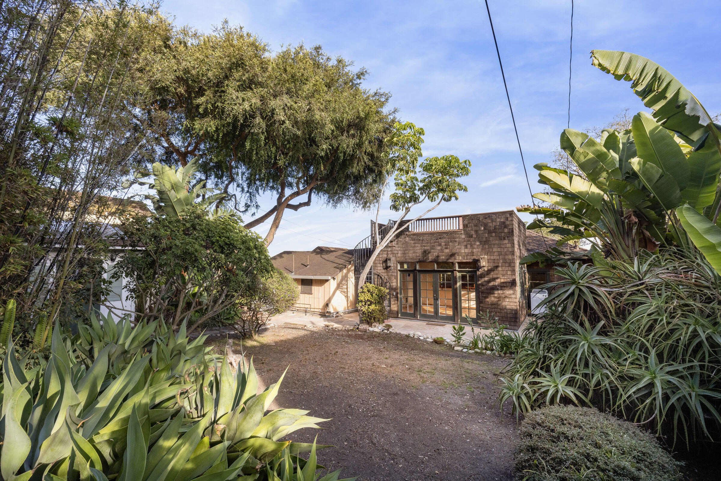 1126 Las Olas Avenue Santa Barbara, CA 93109 - Photo 6 of 24 a view of a street with some trees