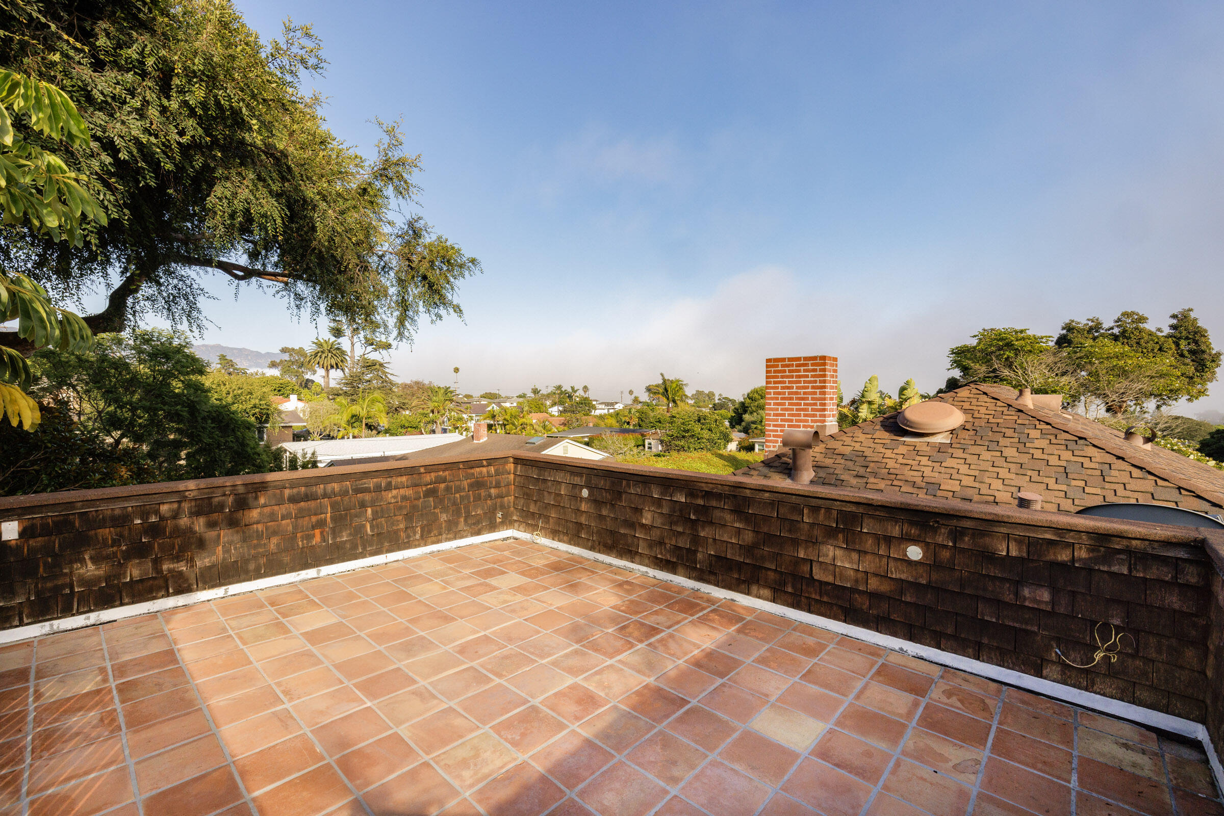 1126 Las Olas Avenue Santa Barbara, CA 93109 - Photo 9 of 24 a view of a back yard of the house and a yard
