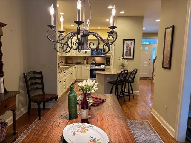a view of a dining room with furniture and wooden floor