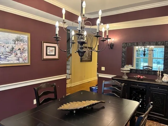 a room with furniture and view of kitchen